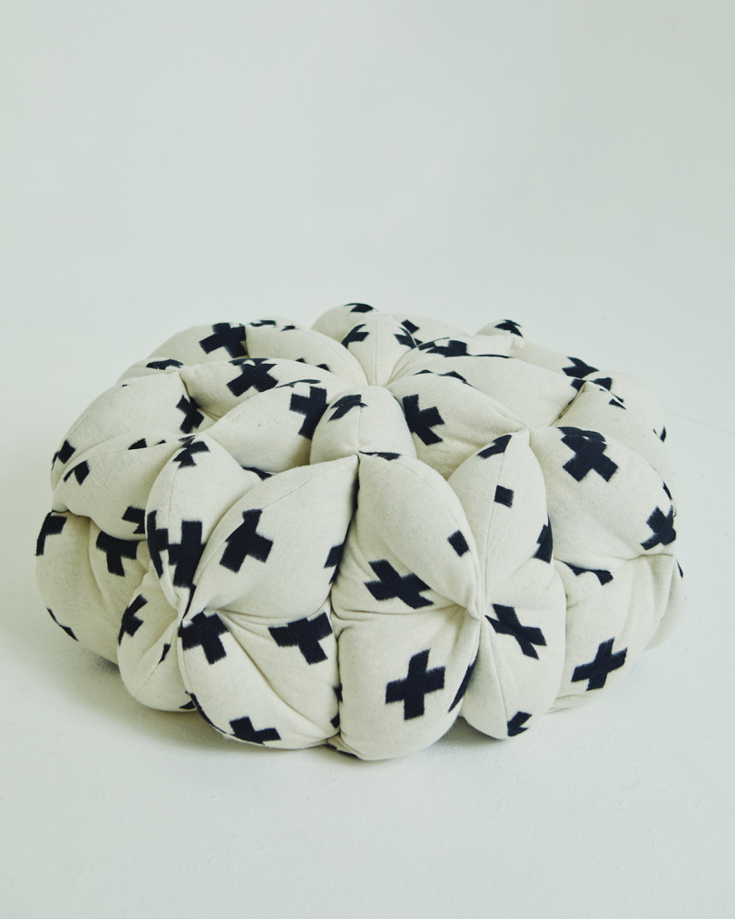 pouf in white with black crosses