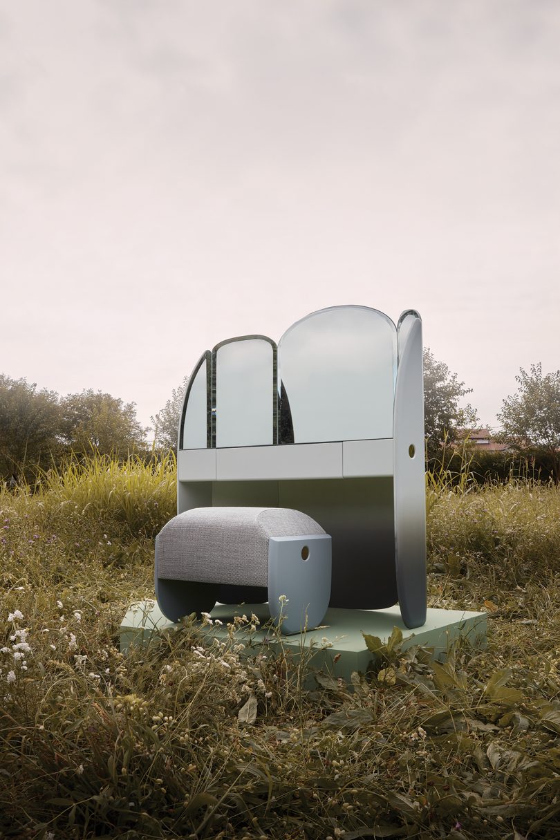vanity with trifold mirror, drawer, and bench in the middle of a field