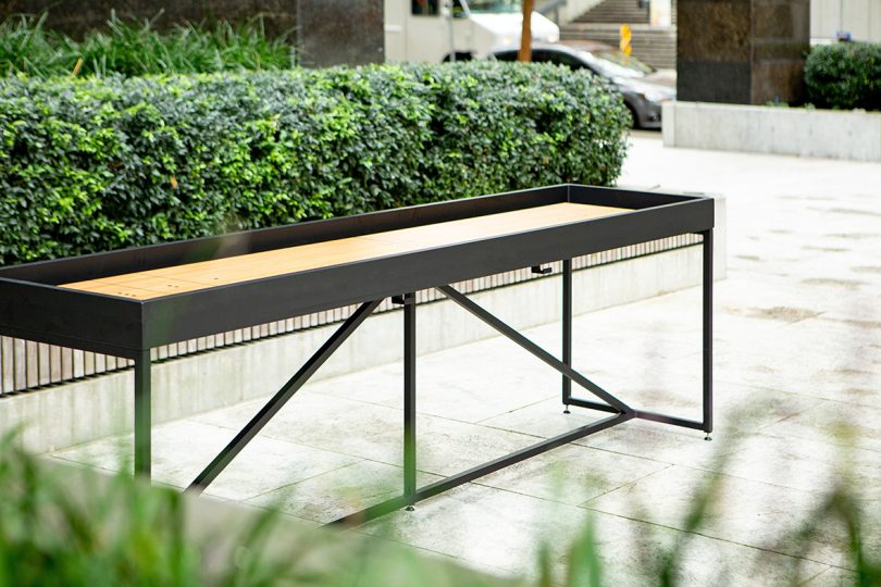 outdoor shuffleboard table on concrete patio