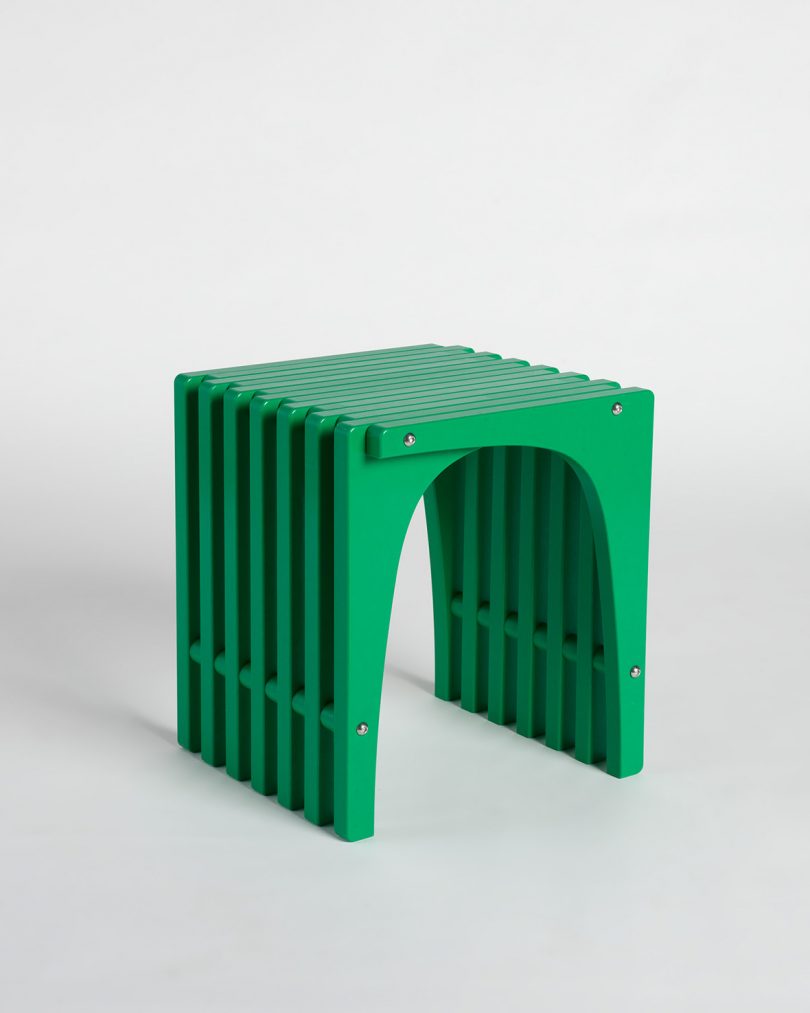 green stool on grey background
