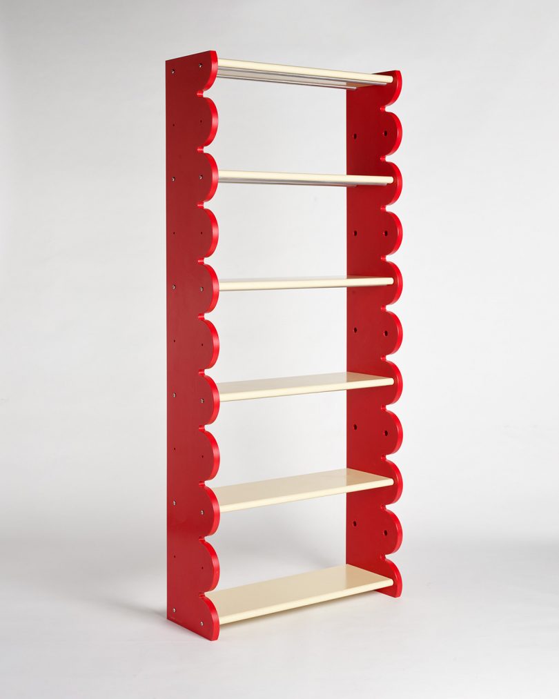 tall red and natural wood bookshelf