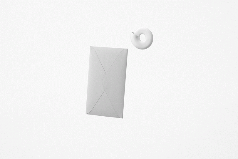Animation of nautilus shell opening white paper envelope