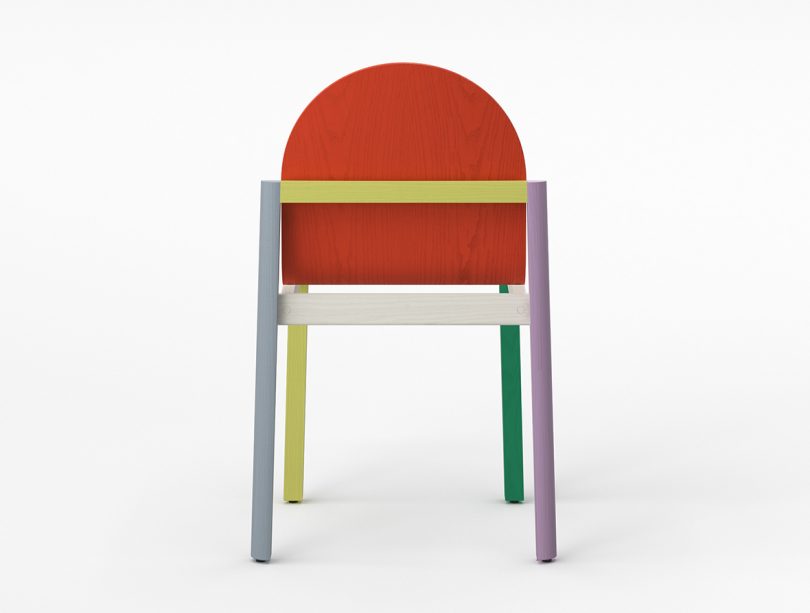 back of multicolored four legged chair on white background