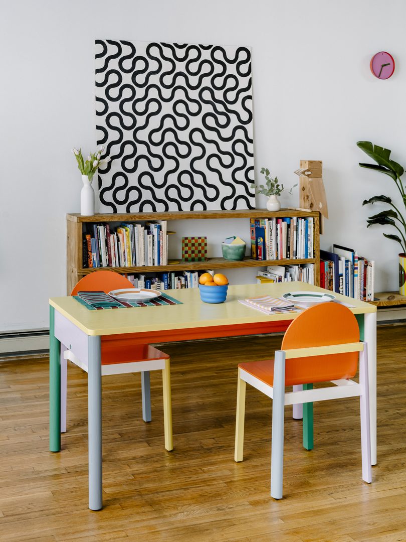 multicolored desk and chairs in styled space