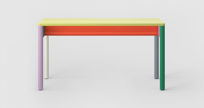 multicolored four legged desk on white background