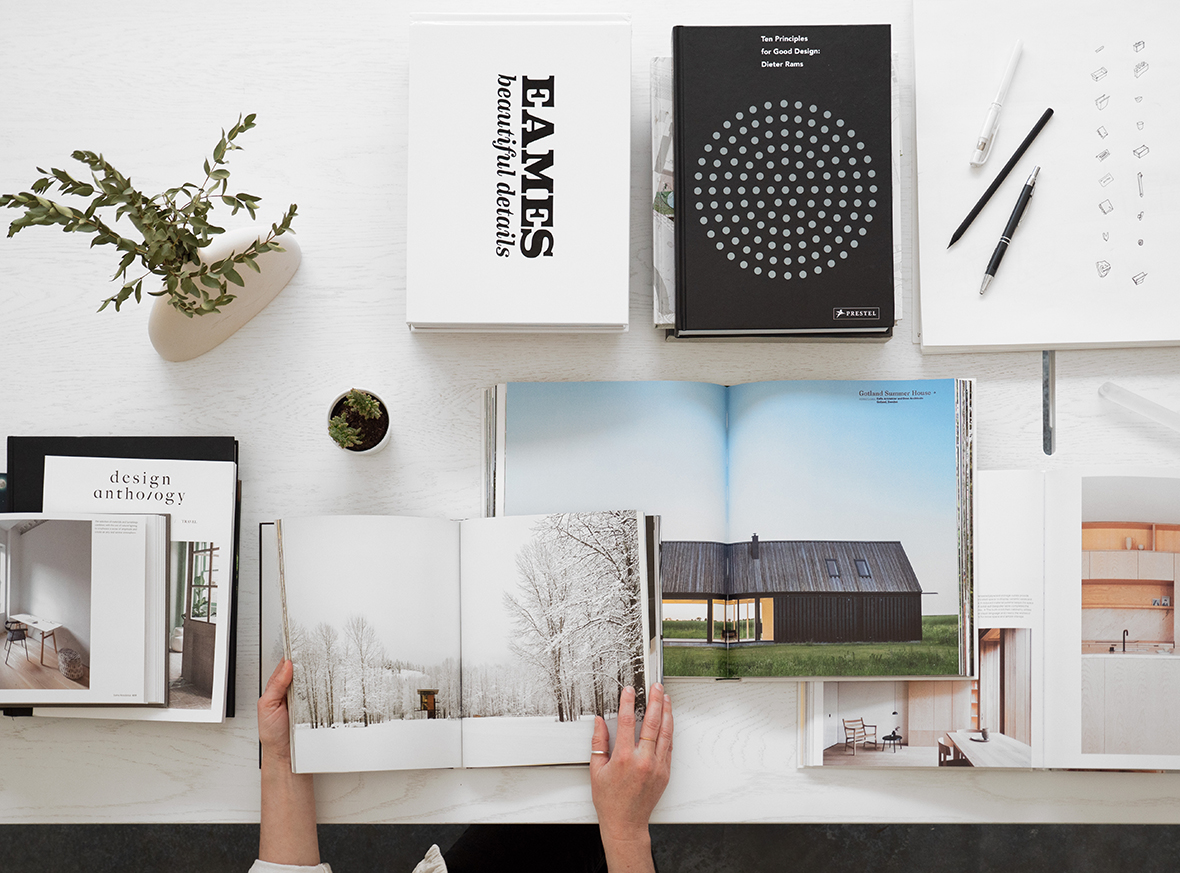 overhead image of surface covered in stacks of coffee table books