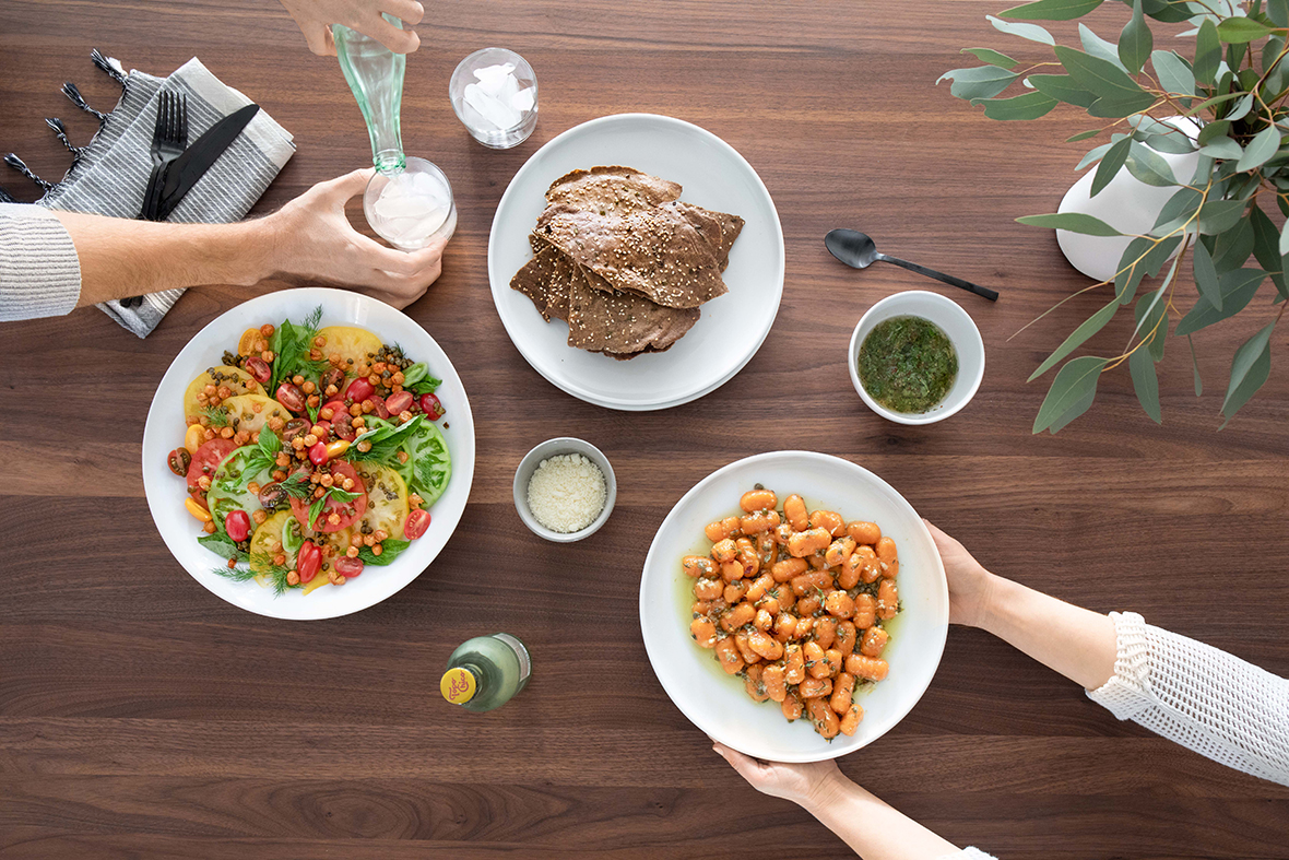 overhead photo of a dining table with plates of food