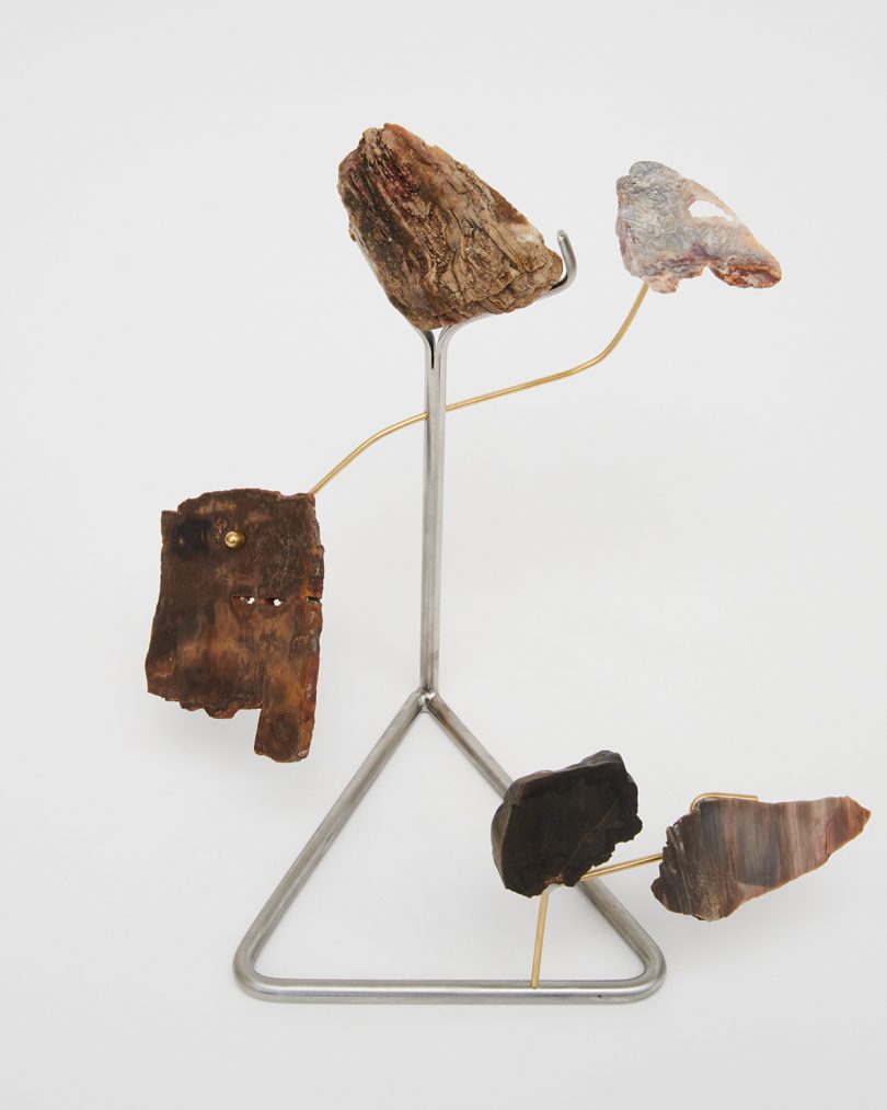 sculpture featuring rocks and minerals on white background