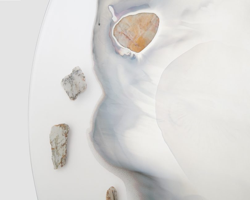 detail of large wall mirror featuring rocks and minerals
