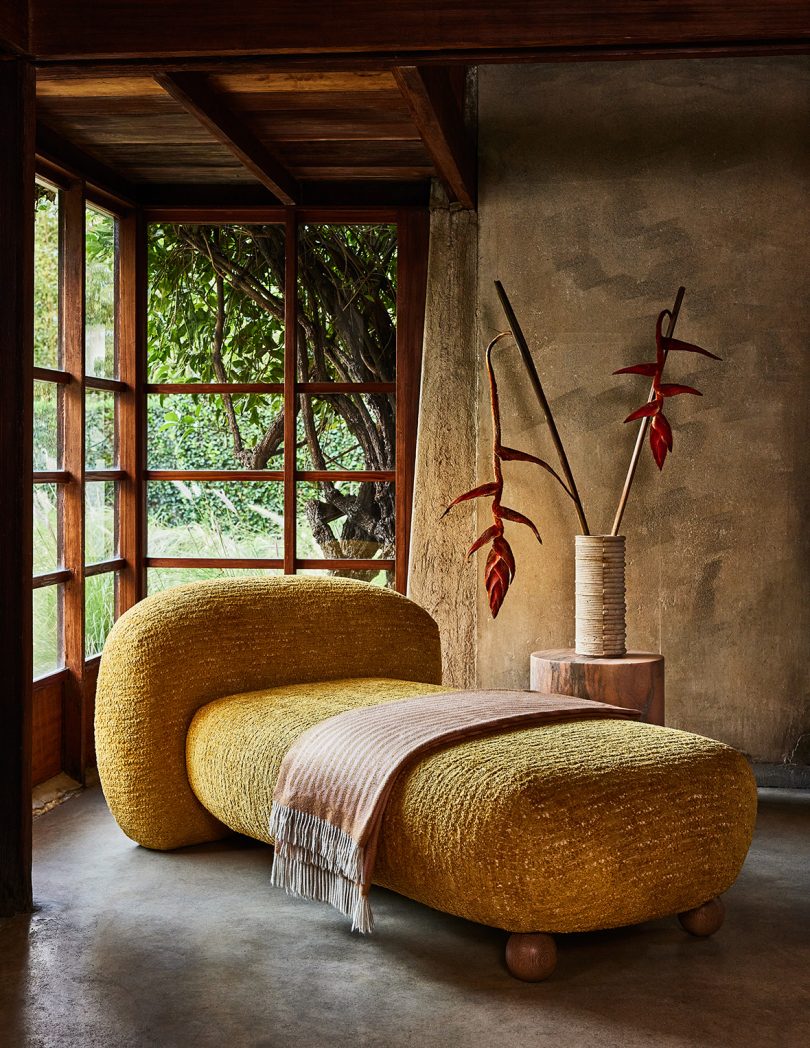 styled interior space with gold chaise