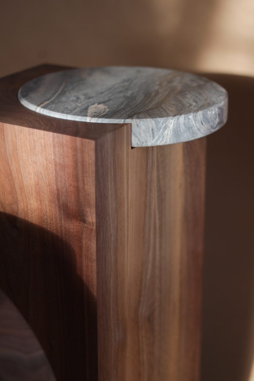 detail of wood and marble side table