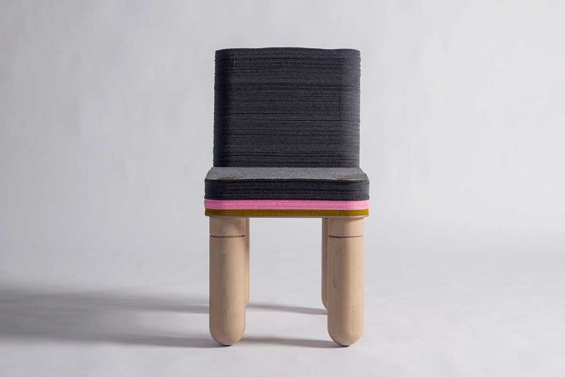 black, pink, and tan felt dining chair