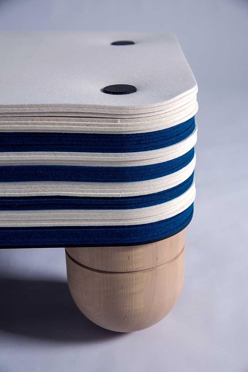 detail of navy and white felt club chair