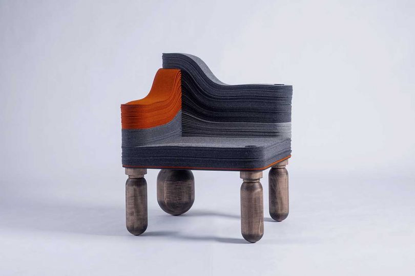 grey and orange felt corner chair