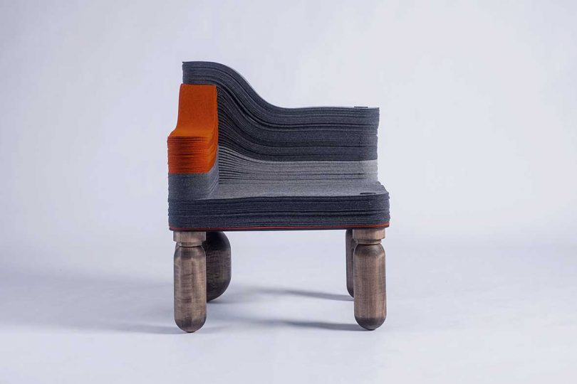grey and orange felt corner chair