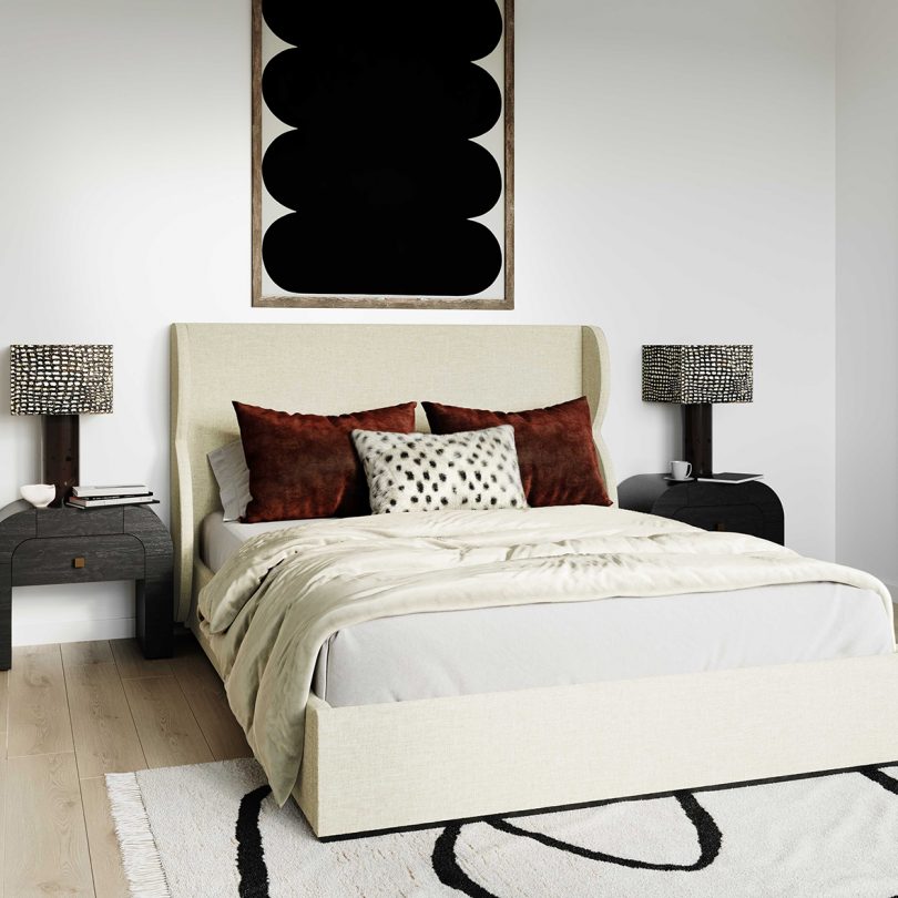 white fabric bed frame with two side tables and lamps