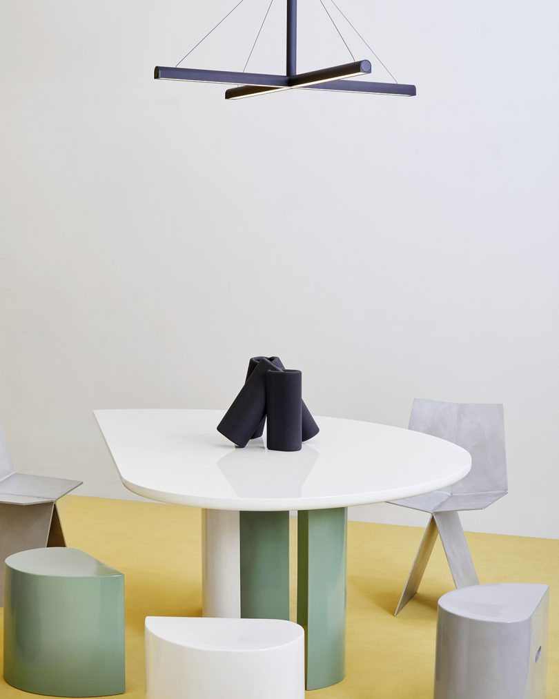 dining table, chair, stools, table sculpture, and lighting