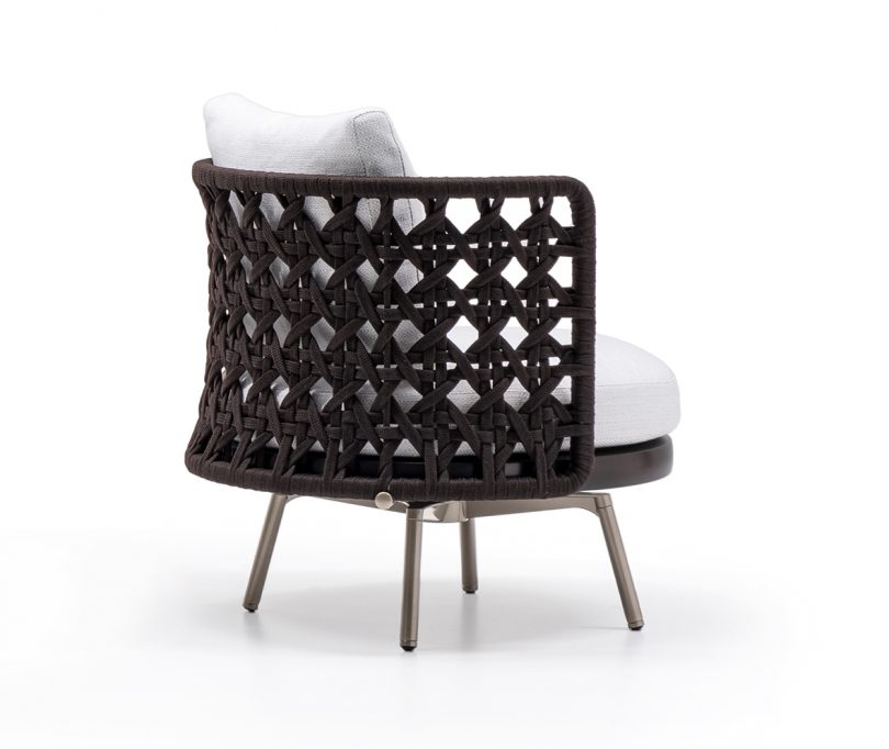 armchair with woven back and arms on white background