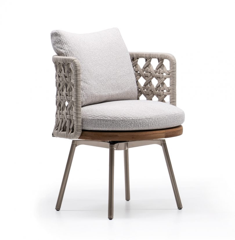 dining chair with woven back and arms on white background