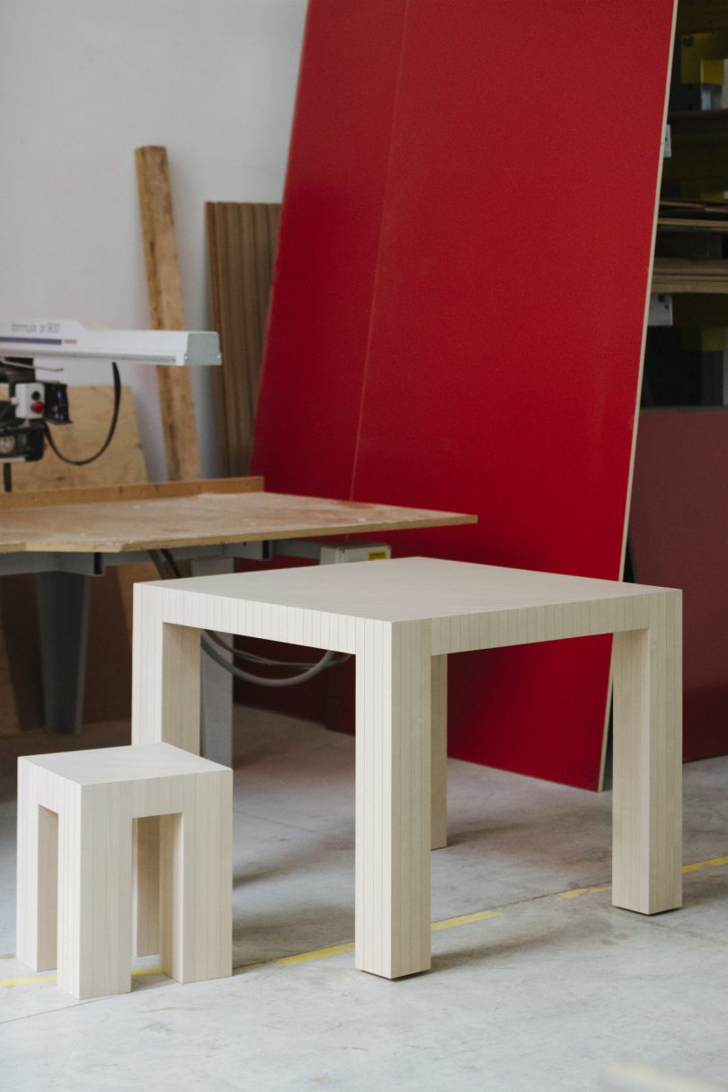 simple light four legged table and stool