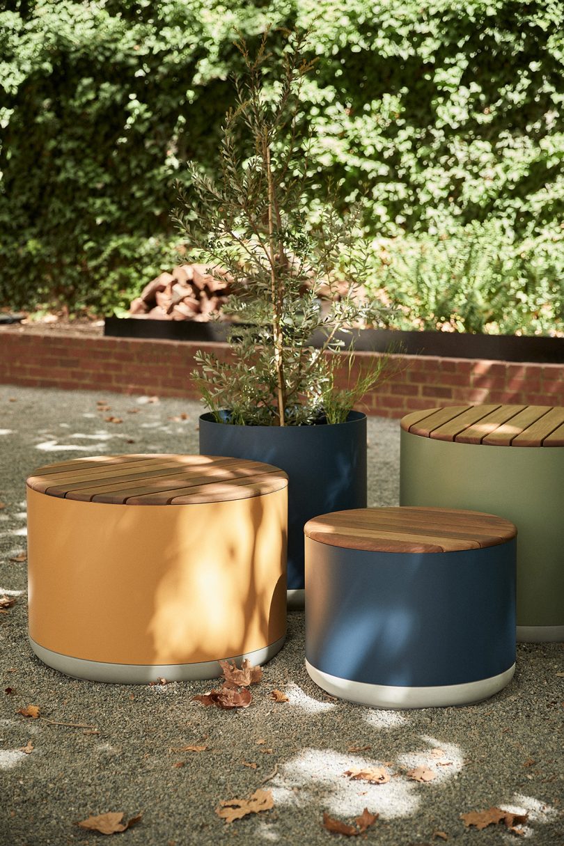 large yellow, brown, blue, and grey planters