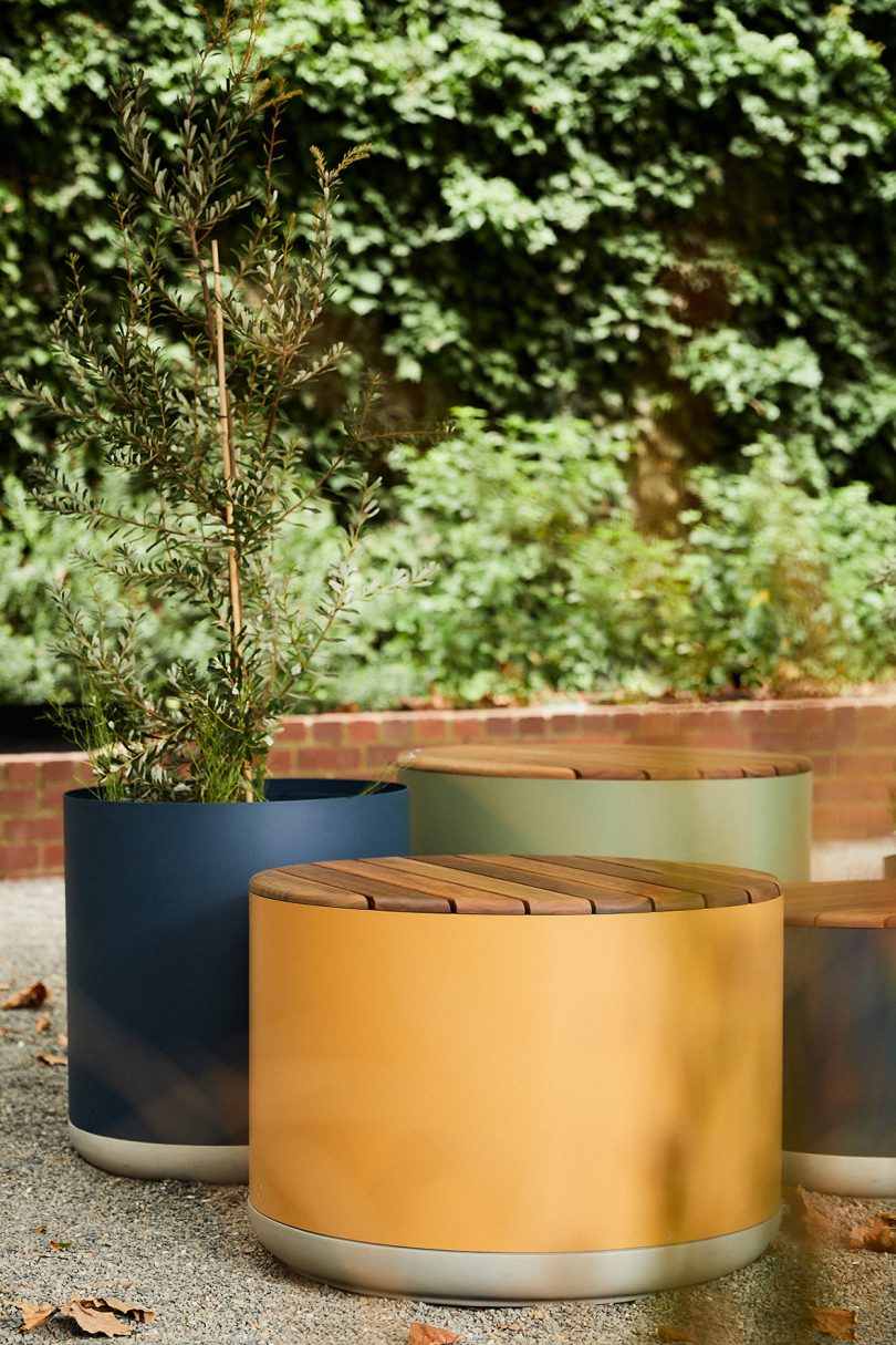 large blue, yellow, and green planters