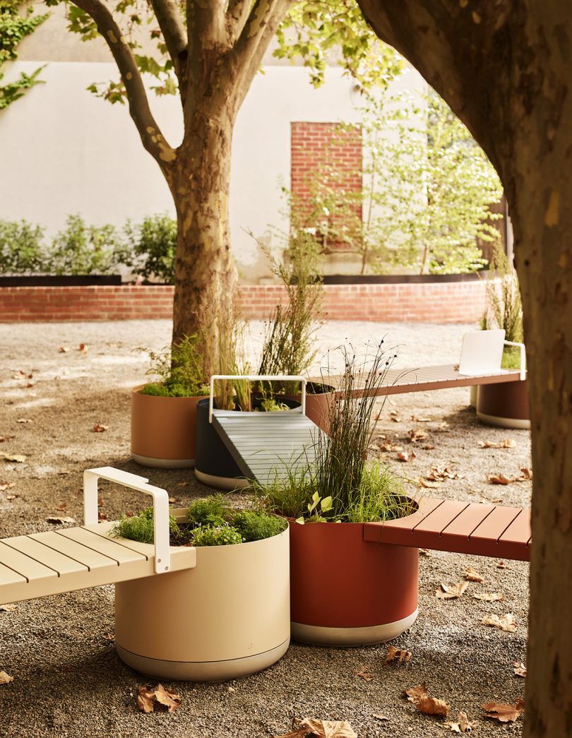 brown and cream outdoor benches and large planter hybrid