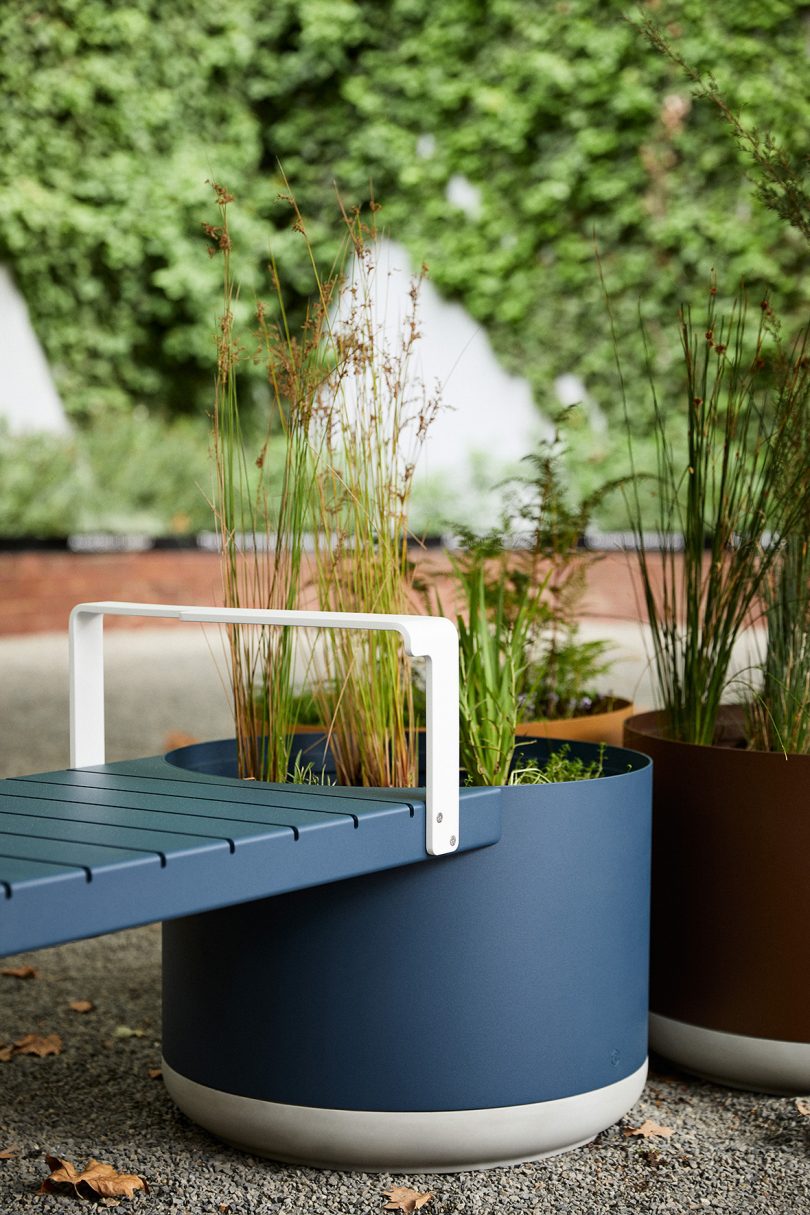 brown and blue outdoor benches and large planter hybrid
