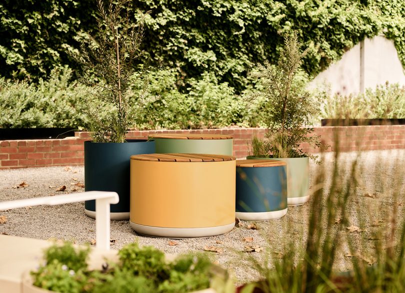 large yellow, brown, blue, and grey planters