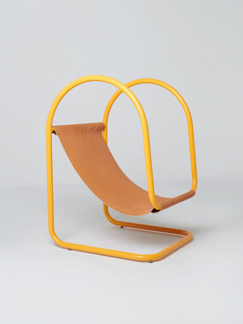 yellow and brown leather suspended sling chair