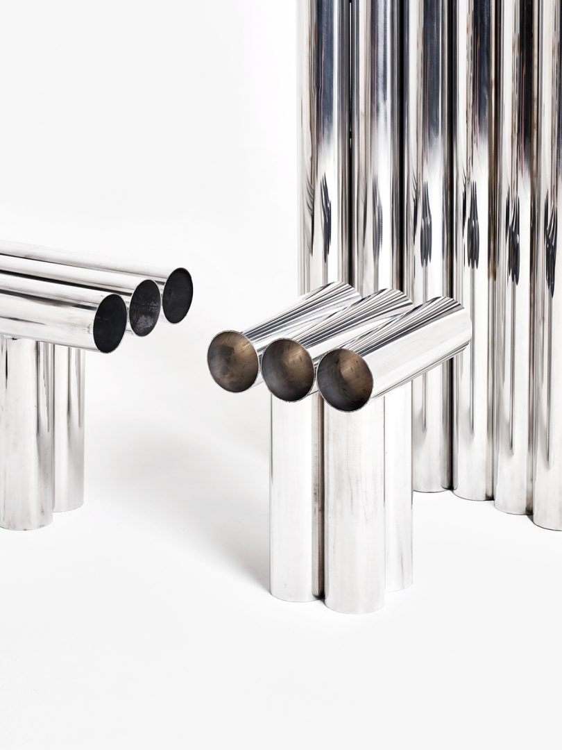 three pieces of furniture made of chrome tubing