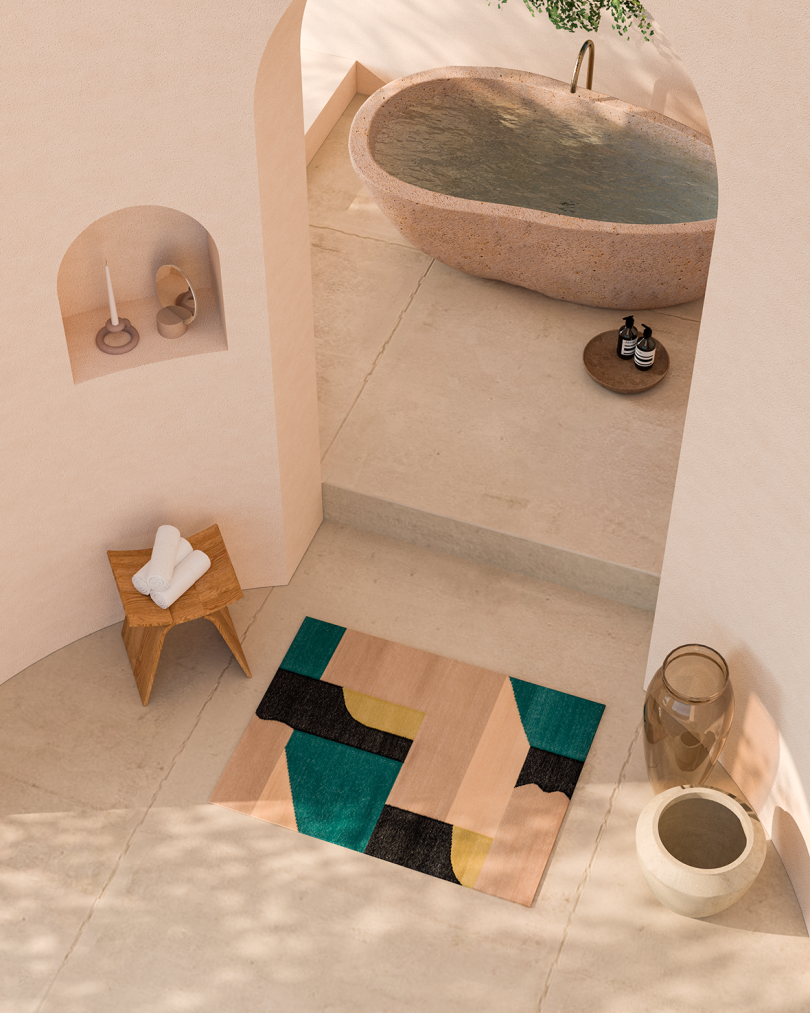 overhead photo of modern concrete bath space with colorful abstract rectangular rug