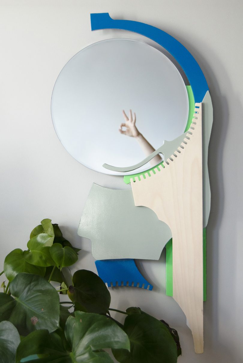 wall mirror with various colors of wood