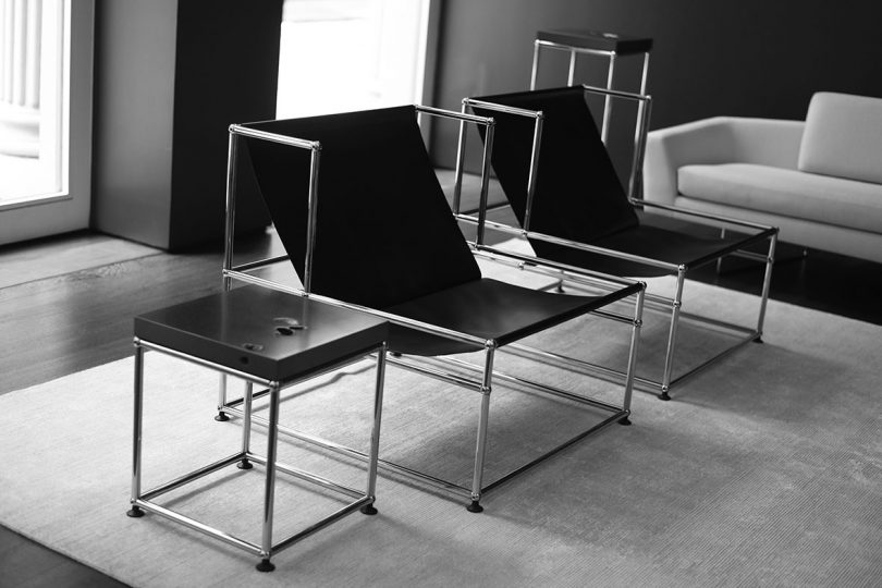 black sling armchairs with metal structure