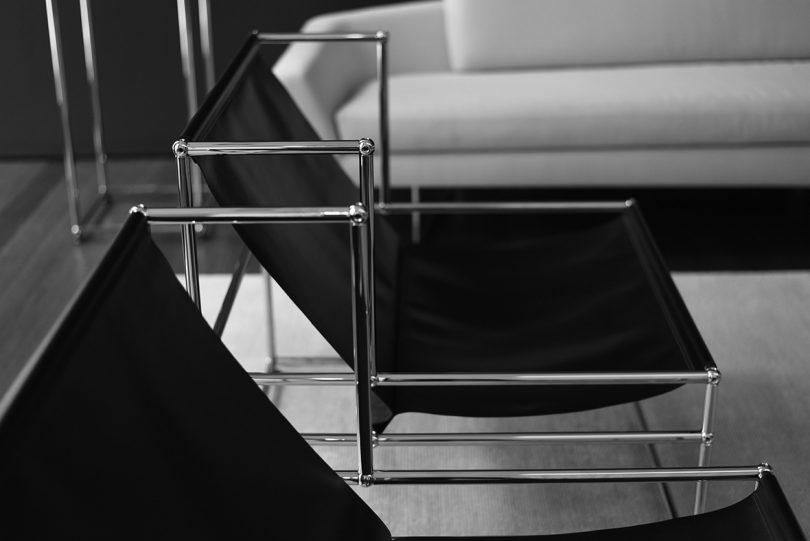 detail of black sling armchairs with metal structure