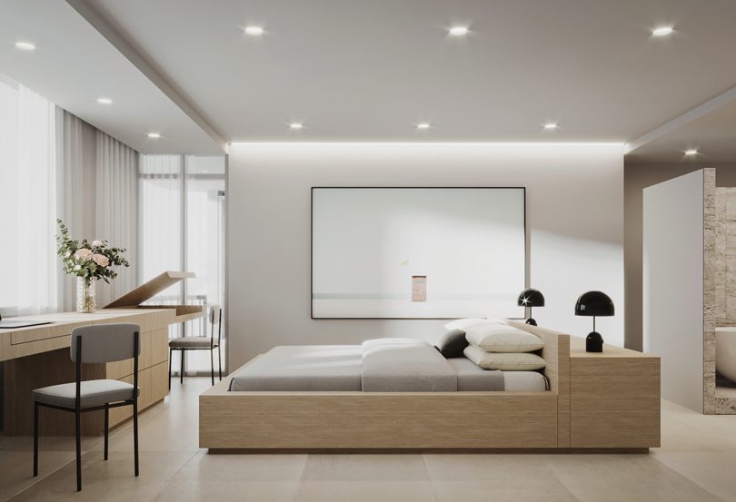 neutral colored bedroom with platform bed with desk and large piece of wall art