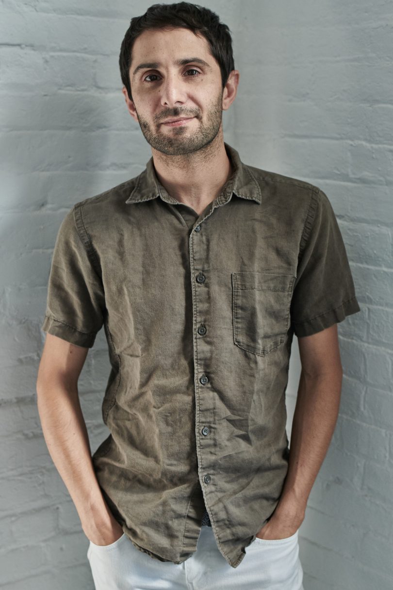 brown-skinned man wearing short sleeved grey button down shirt