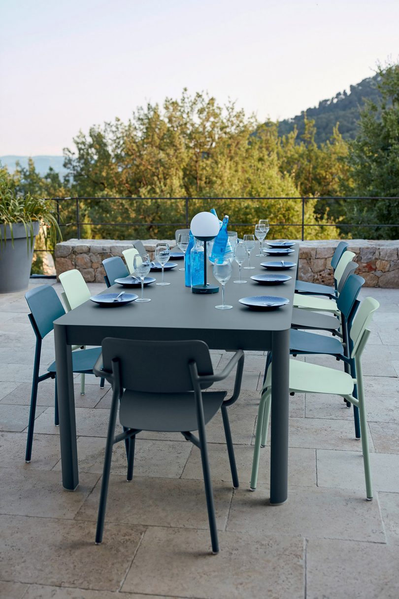 black dining table and chairs on outdoor patio
