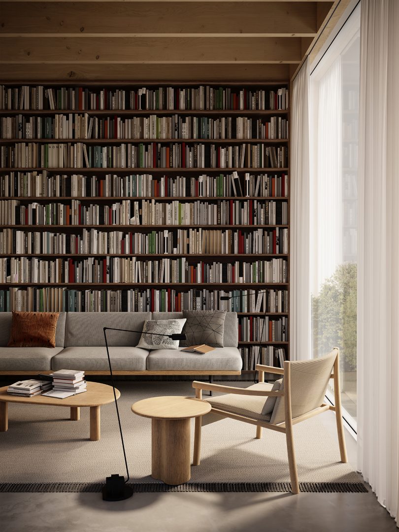 two low tables in styled interior space with wall of bookshelves