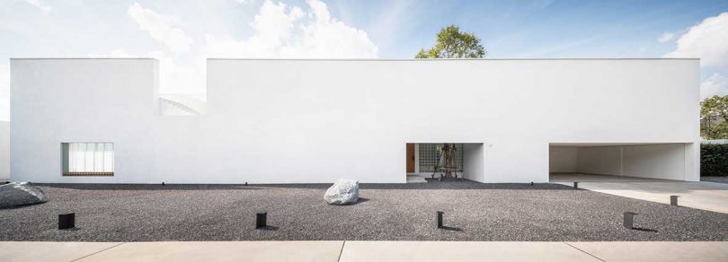 A Bangkok Home With a Bold, White Facade + Minimalist, Cozy Interior