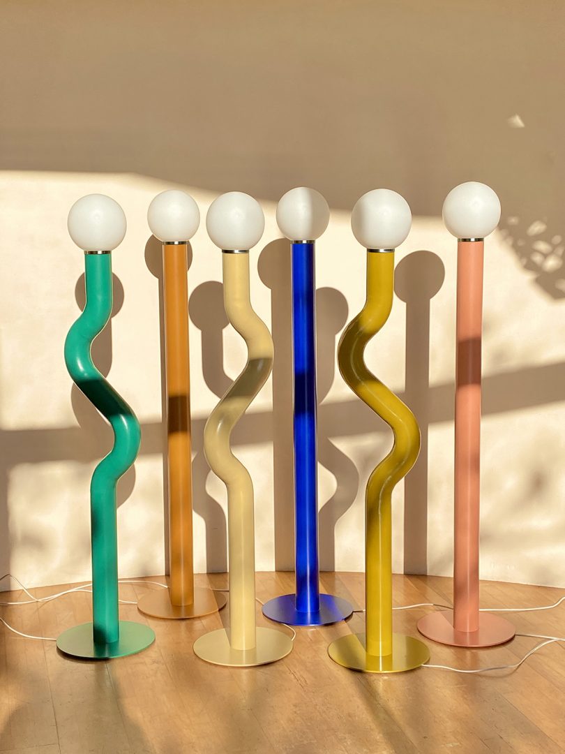 various colors of curvy and straight floor lamps