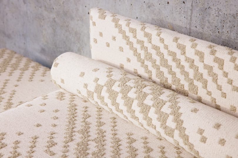 detail of neutral colored patterned sofa