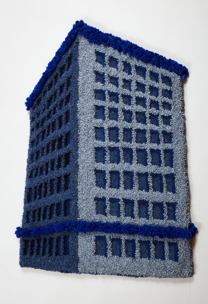 blue and grey building-shaped tufted rug