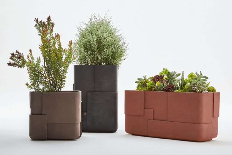 three large outdoor planters on white background