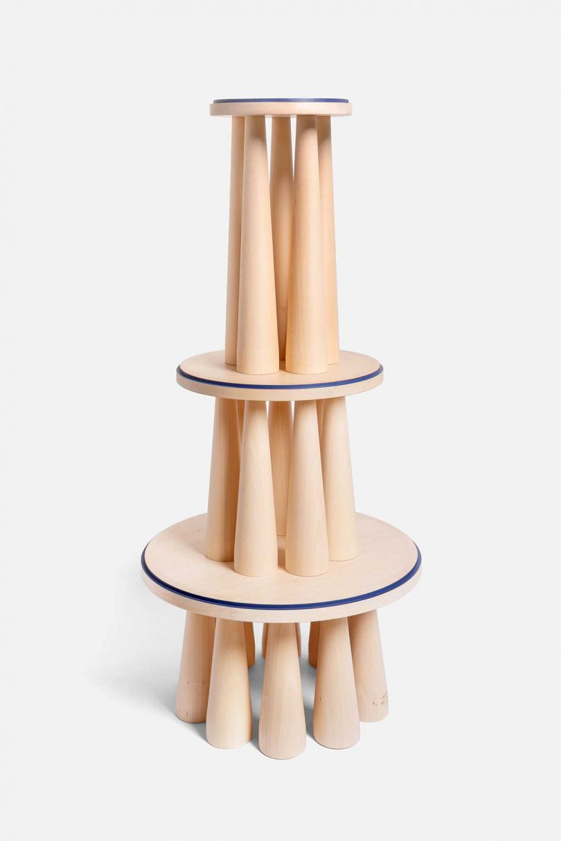 stacked trio of light wood high furniture on white background