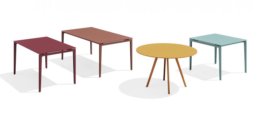 four colorful outdoor tables of varied sizes and shapes