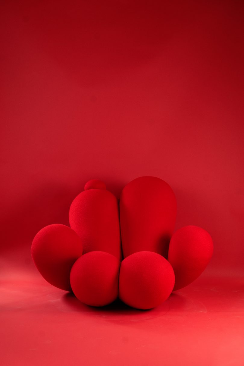 bulbous red armchair on red background