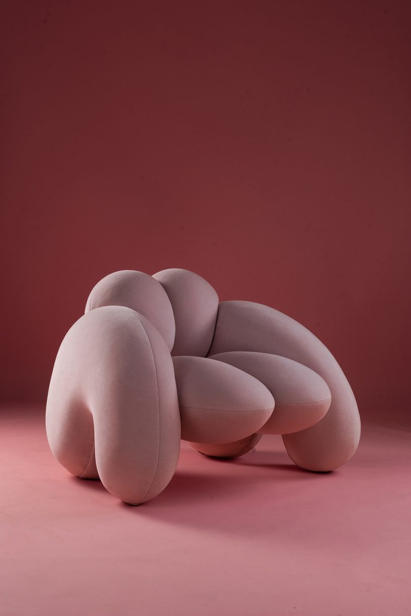 bulbous light pink armchair on pink background