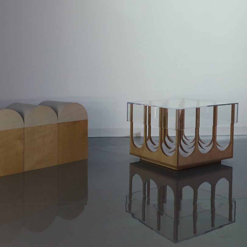 two wood and glass pieces of furniture