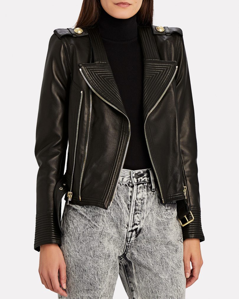 model wearing black leather motorcycle jacket